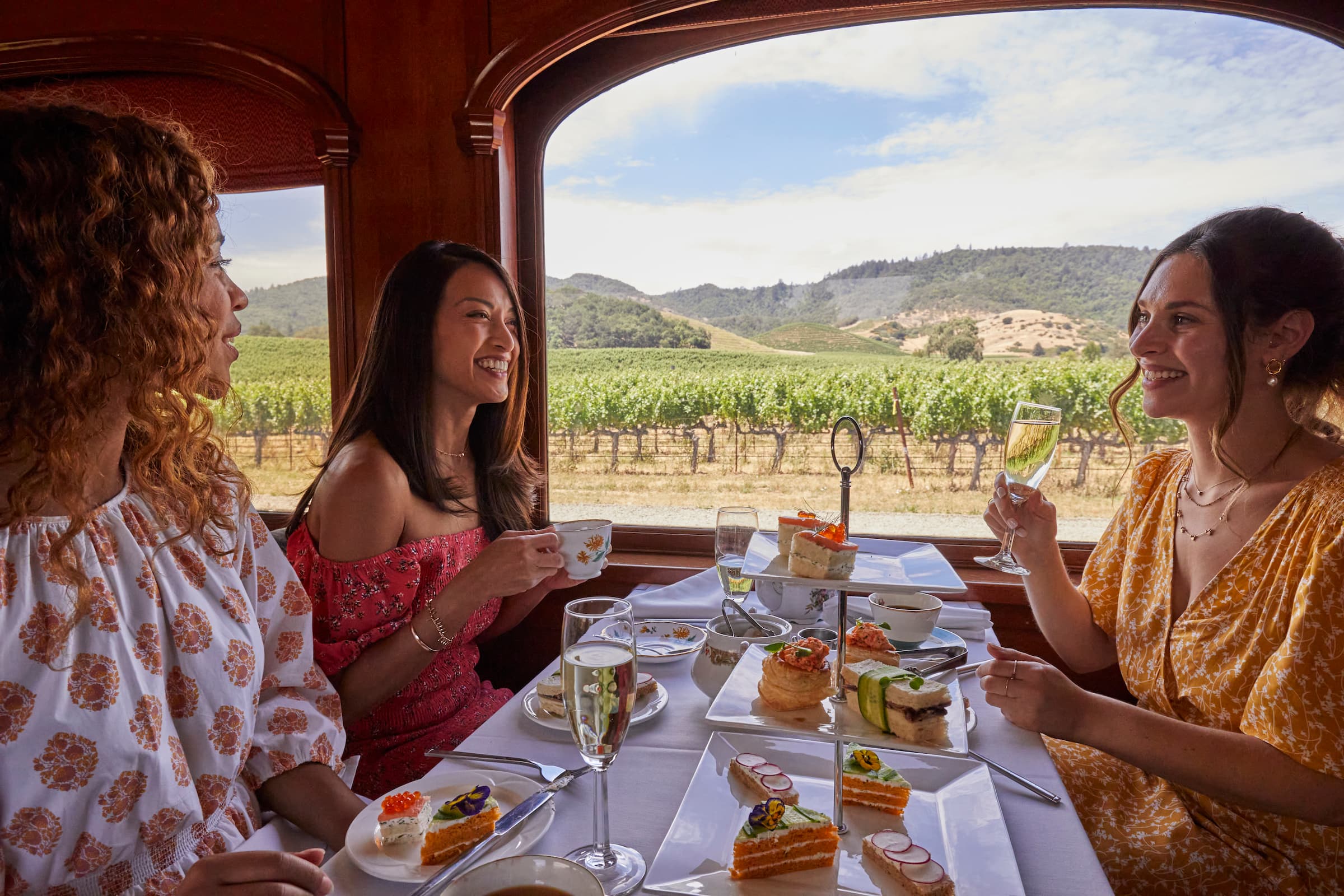 Women having afternoon tea together aboard the Napa Valley Wine train
