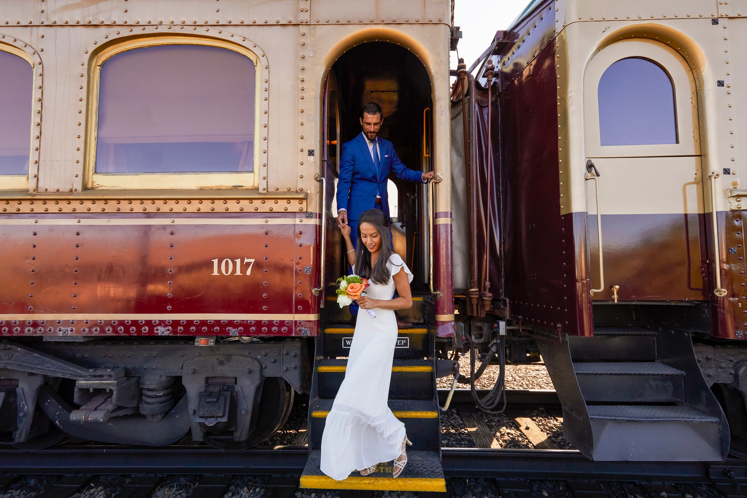 Couple taking wedding pictures at the Napa Valley Wine Train