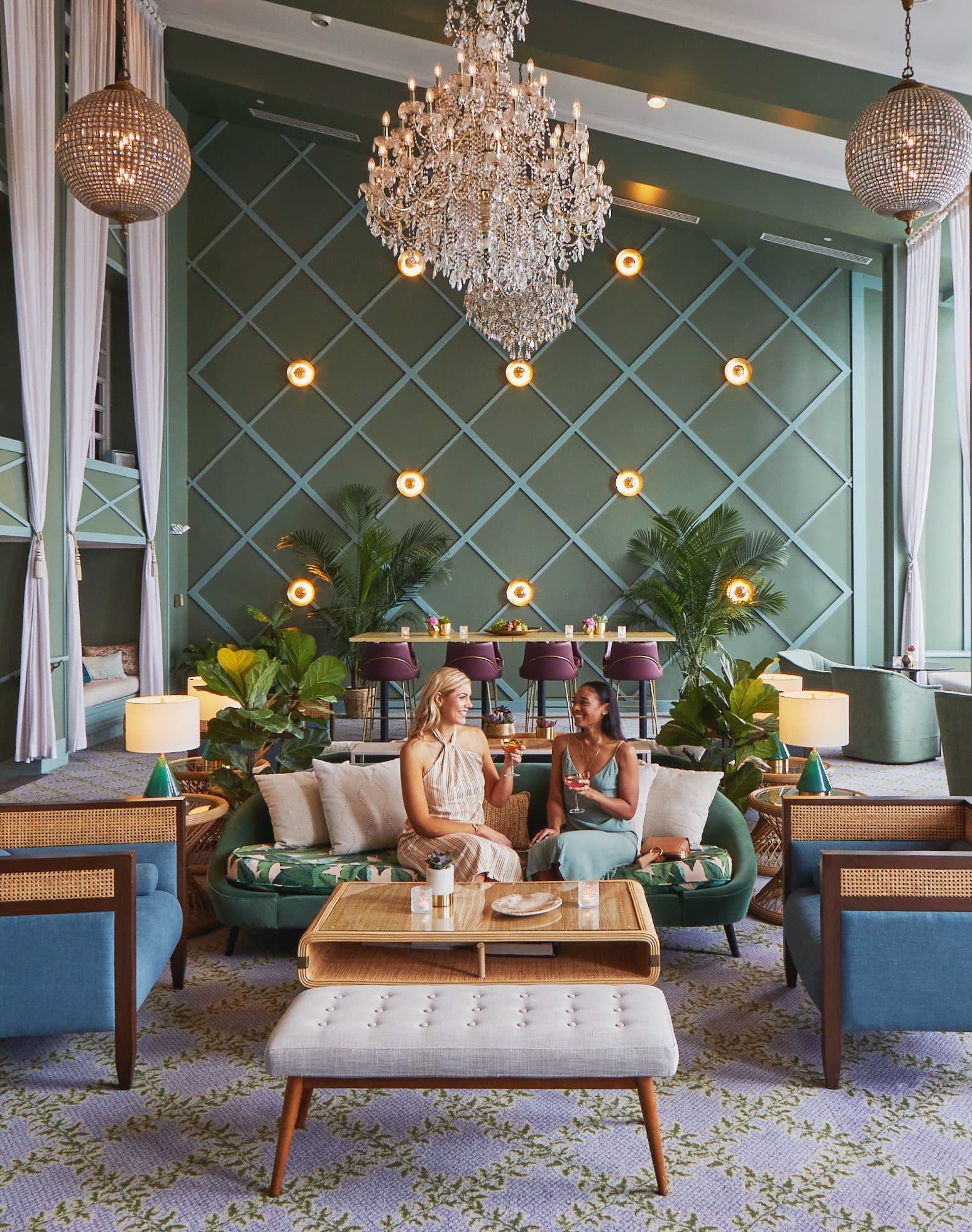 Two women having drinks at the Portofino's seating area