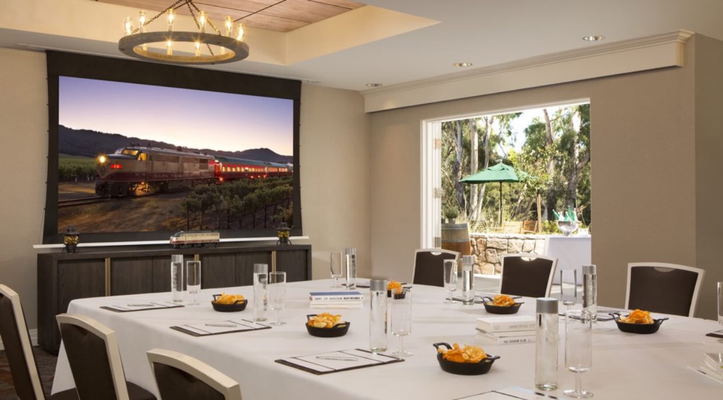 Meeting space with a table and projector at the River Terrace Inn in Napa, California