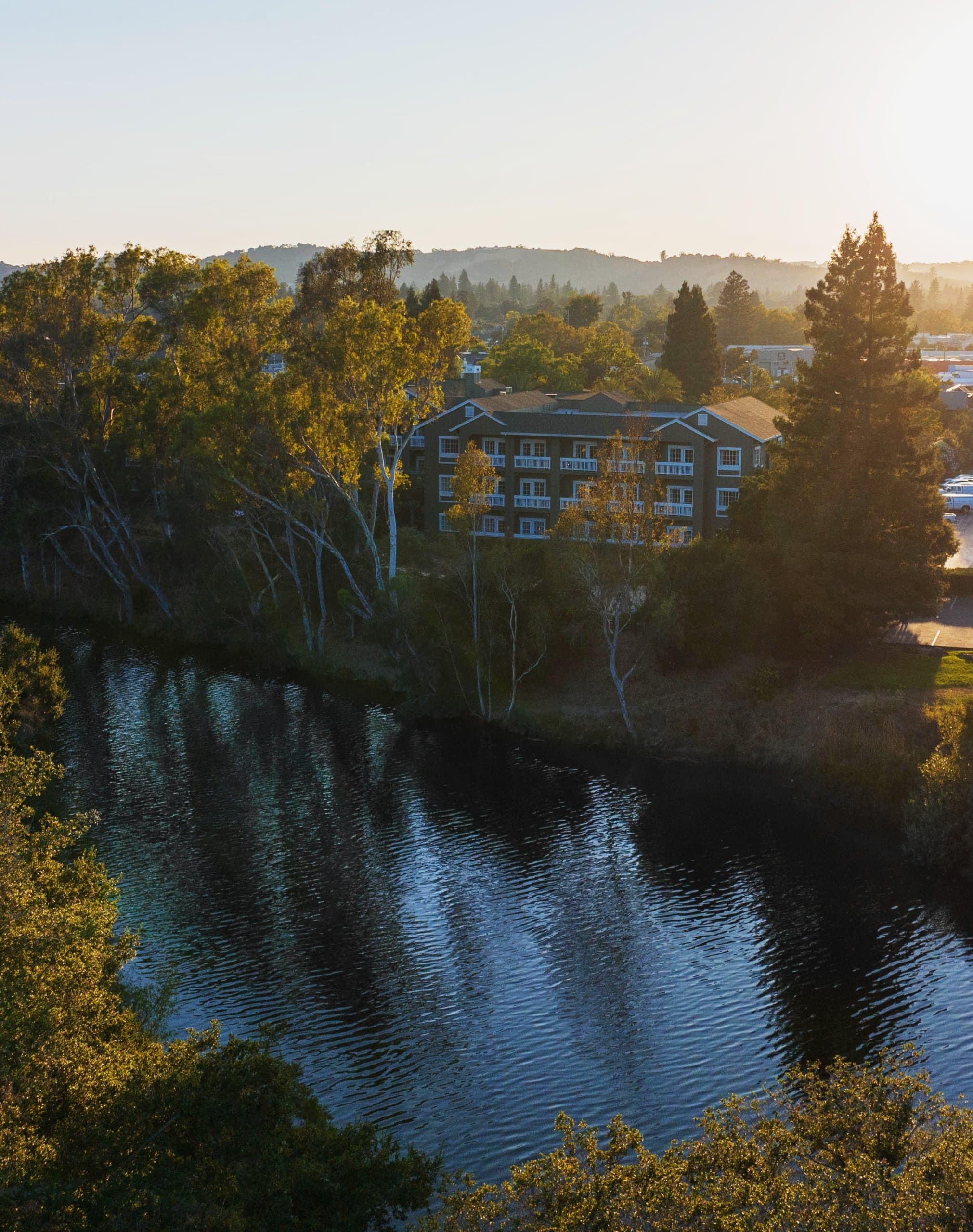 Exterior of the River Terrace Inn next to the water