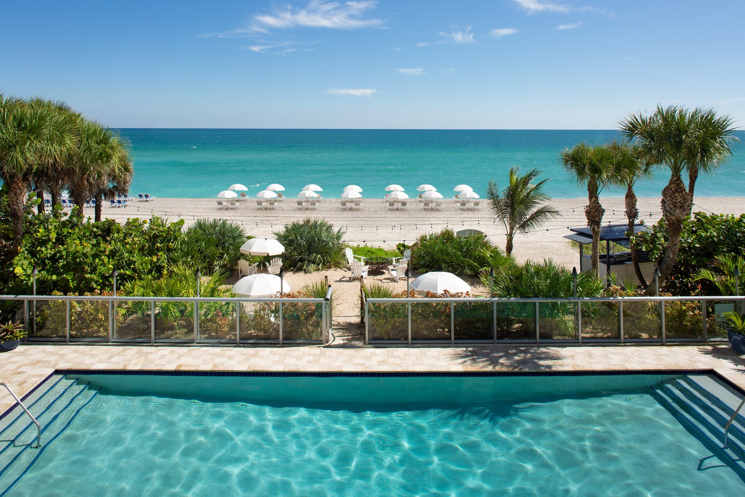 Pool with path to the beach at Solé Miami, Florida