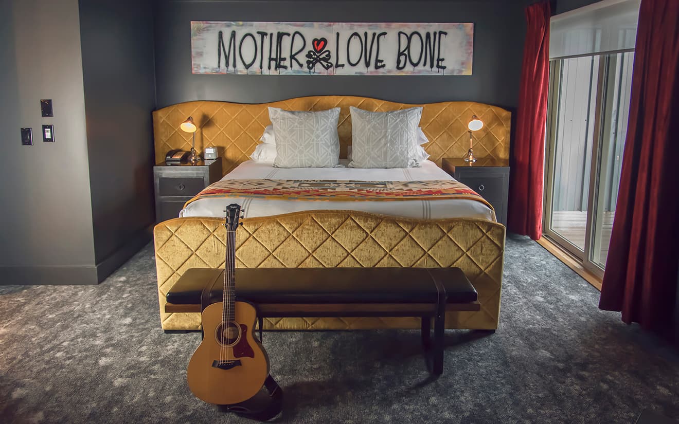Bed of the Pearl Jam Suite from The Edgewater Hotel