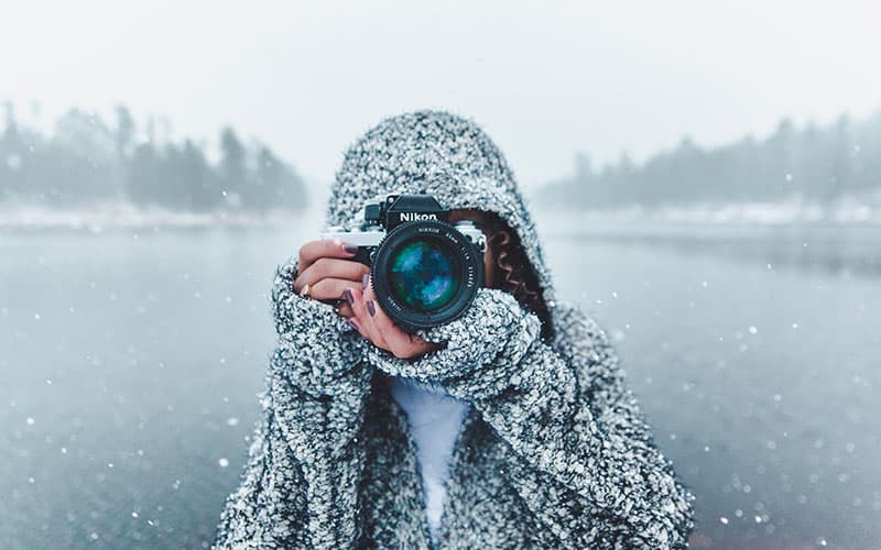 Woman taking a picture in Jackson Hole
