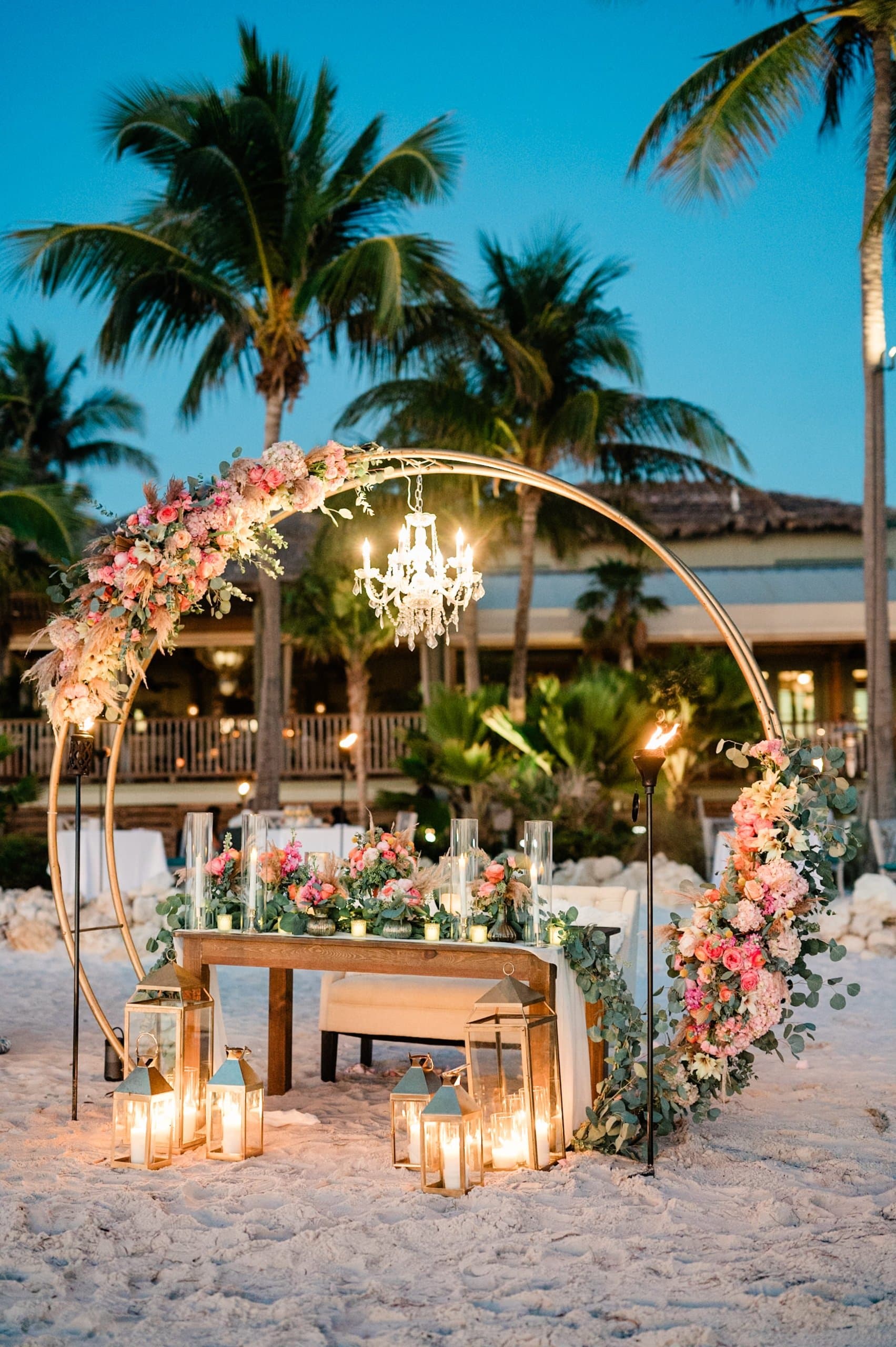 Wedding table set on the beach at a Noble House Hotels & Resorts property
