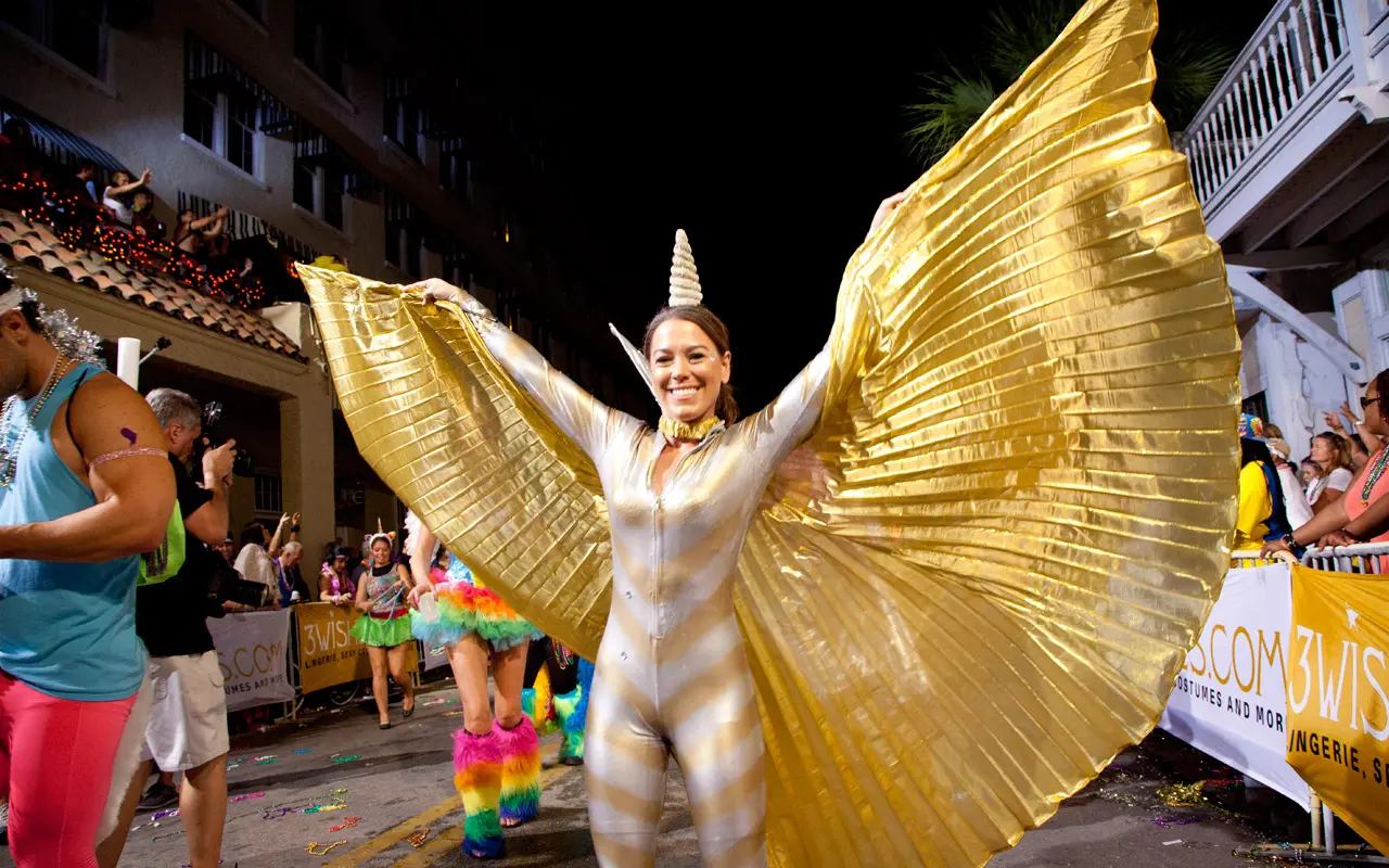 Woman dressed in a gold unicorn costume at Fantasy Fest