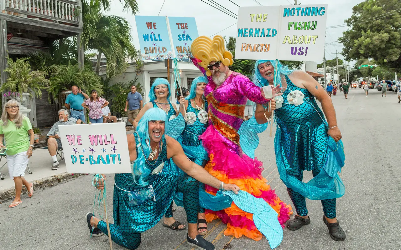 People dressed as comical mermaids at the Fantasy Fest Costume Party