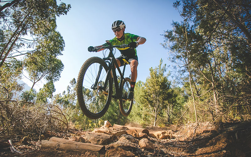 Mountain Biker Doing A Jump.