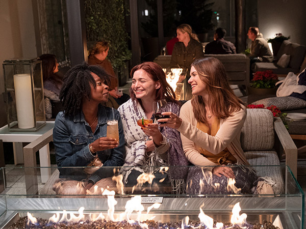 Ladies Having A Drink Outside At Hotel Zoe.