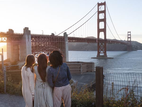 Girls Looking At The Golden Gate Bridge.