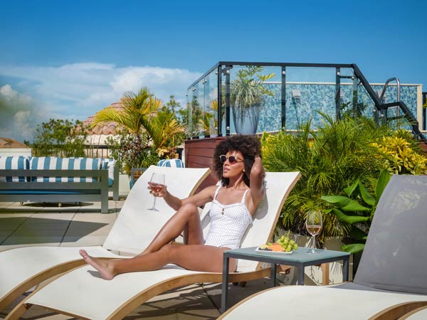 Lady Lounging By The Pool