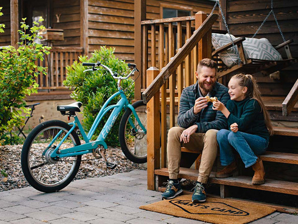 dad/daughter on cabin steps